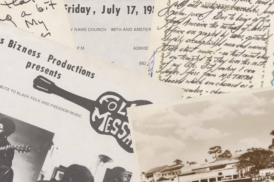 Slightly browned archival papers, flyers, and photographs are stacked on top of one another.