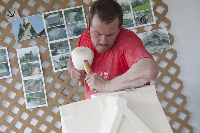 Selwyn Jones demonstrates stonework to visitors in the Wales program at the 2009 Folklife Festival. Photo by John Loggins, Ralph Rinzler Folklife Archives and Collections, Smithsonian Institution