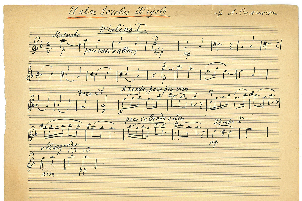 Handwritten musical notation on a browning sheet of paper.