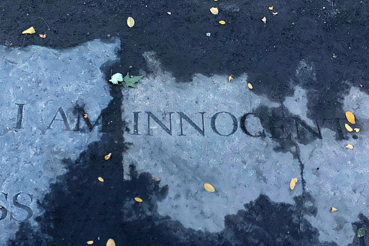 Gray stone etched with the words, I am innocent.