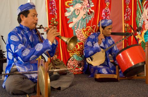 Members of the Hat Boi Folk Opera from Vietnam perform in the Mekong River program at the 2007 Smithsonian Folklife Festival. Photo by Richard Strauss.