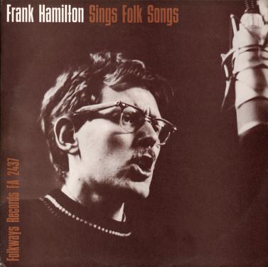 Album cover with title: Frank Hamilton Sings Folk Songs. Monochrome photo of a man with glasses, a mustache, and a sweater singing into a studio microphone.