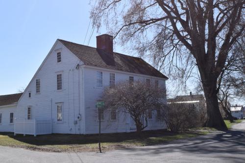 Same house with different streets, and now with paved roads surrounding. Color photo.