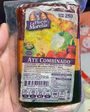 Close-up on a package a fruit candies with label in Spanish: La Flor de Morelia brand. Ate Combinado. Image of apples, strawberries, lemons, and other fruits.