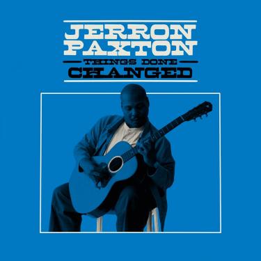 Album cover with title and artist: Jerron Paxton, Things Done Changed. Below the title, a monochrome photo of Jerron playing acoustic guitar, tinted like the blue background.