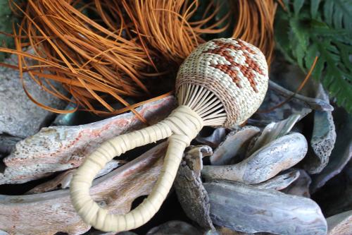 Closeup on a woven grass rattle.