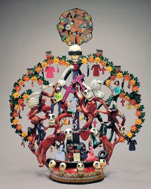 Ceramic Tree of Life sculpture with orange flowers, red crosses, human skulls, and mutilated, bloody bodies.