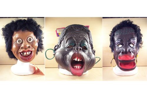 Three disturbing masks side by side of Black characters, with exaggerated features like big lips.
