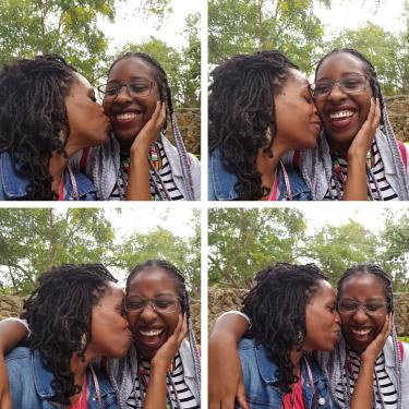 Grid of four images taken in succession: a mother kissing her daughter’s cheek and holding her head, while the daughter smiles and laughs.