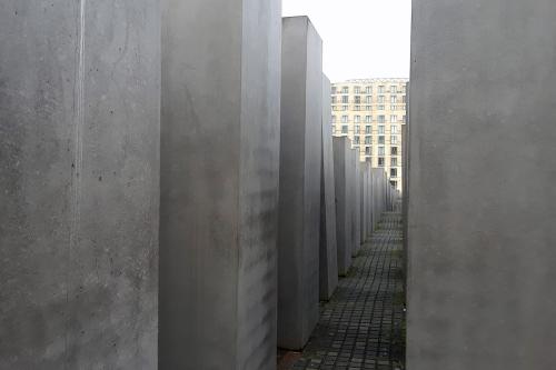 Dozens of tall, cement blocks lined up like buildings in a dense city.