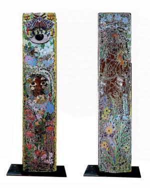 Front and back views of a sculpture, a tall rectangular panel with tiled mosaic on both sides. The mosaic includes images of blooming flowers, an eye, and Black figures.