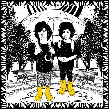 Black-and-white illustration for a quilting design, showing two young nearly identical girls under a shared umbrella, standing in a rain puddle in a park. The only other color is their yellow rain boots.