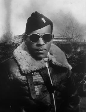 Black-and-white photo of James Wiley in bomber jacket, shades, and military cap