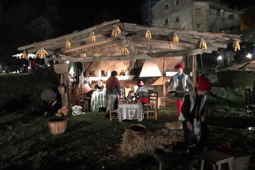 At night, a family works in an outdoor home scene.