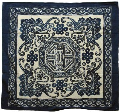 Square calico textile, with the Chinese longevity knot design on all four sides.