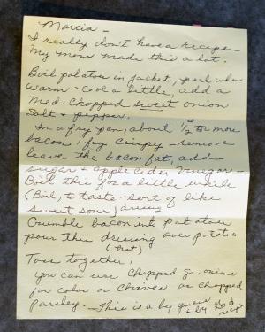 Handwritten recipe on a yellow notecard. The recipe is transcribed later in the article.