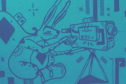 Mural of a stylized rabbit using a video camera.