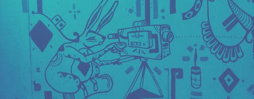 Mural of a stylized rabbit using a video camera.