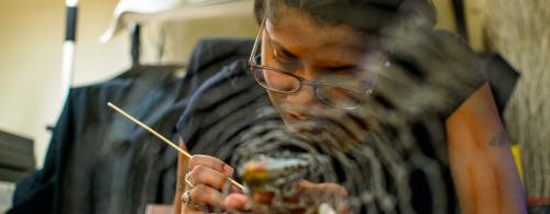 Working in clay, Tibetan bronze sculptor and Lag Zo participant Nima puts the finishing touches on Buddha’s face. Photo by Dawa Drolma, Smithsonian
