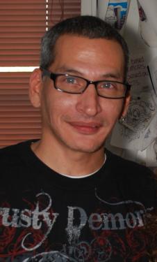 The artist, Charles &ldquo;Coco&rdquo; Bayron, in his shop.