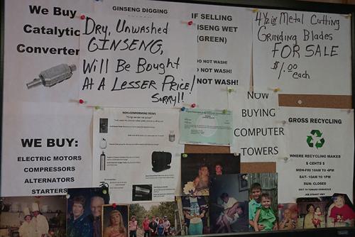 A full bulletin board including a sign written in black marker in the top left corner. Sign text: Dry, Unwashed GINSENG, Will Be Bought At A Lesser Price! Sorry!! 