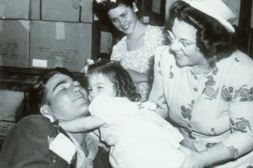 Wounded soldier greeted by his siter