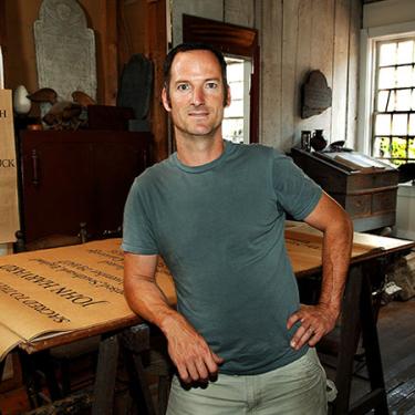 Nick Benson, a third-generation stone carver and letterer, is the owner and creative director of The John Stevens Shop in Newport, Rhode Island. Photo by Tom Pich