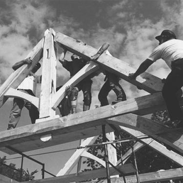 Timber framers from around the world came together to build and raise a 65 traditional timber frame structure in Penetanguishine, Ontario. Photo by Will Beemer, courtesy the Timber Framers Guild 