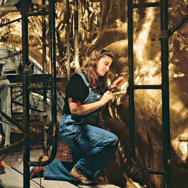 Decorative painter Jacqueline Canning Riccio of John Canning & Co. gilds a horse for the War Memorial Opera House in San Francisco, California. Photo courtesy John Canning & Co.