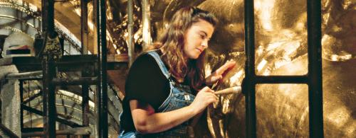 Decorative painter Jacqueline Canning Riccio of John Canning & Co. gilds a horse for the War Memorial Opera House in San Francisco, California. Photo courtesy John Canning & Co.