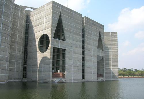 The Jatiyo Sangsad Bhaban is surrounded on three sides by an artificial lake.
