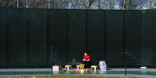 Genevieve Erin O&rsquo;Brien performs a ritual for Vietnam Suitcase at the Vietnam Veterans Memorial in Washington, D.C.