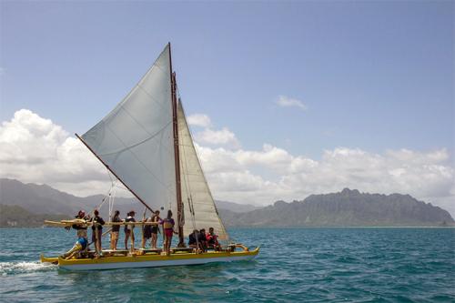 The crew of Kānehūnāmoku Voyaging Academy take students sailing in Kāneʻohe Bay.