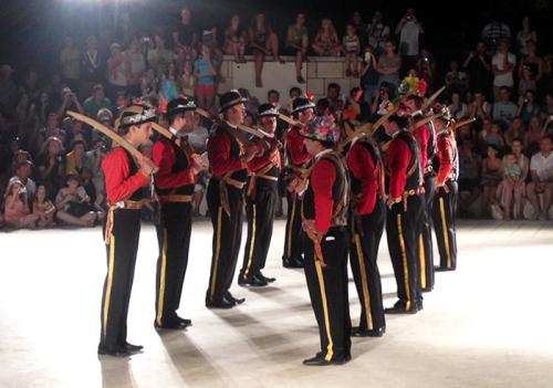 A group from Lastovo Island performs a sword dance at the Sword Dance Festival in Korčula. Here they are in "contra formation."