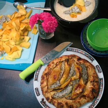Mango cashew galette and coconut sticky rice pudding on the dessert table.