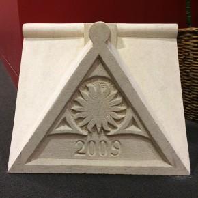 The completed apex stone now adorns the Center&rsquo;s lobby.