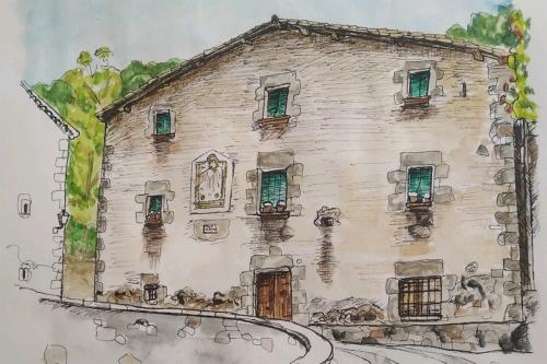 Watercolor illustration of stone house, with cobblestone driveway and wooden door.