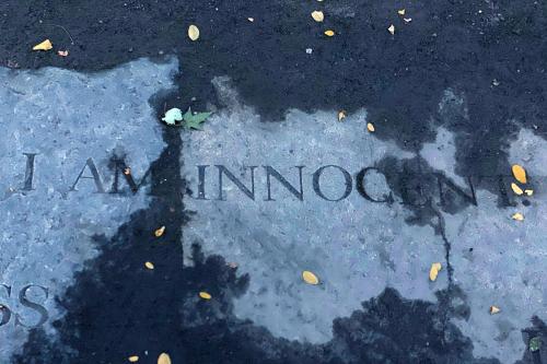 Gray stone etched with the words, I am innocent.