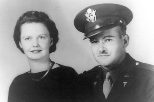 It was customary for soldiers going off to war to get a photo taken in uniform with his family, in this case his bride.