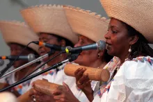 Carlina Andrade, María Juana Angulo, Gladys “Titi” Bazán, and Ana Hernández, members of La Red de Cantadoras del Pacífico Sur, sing and play the guasá at the 2009 Smithsonian Folklife Festival.