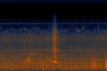 A spectrograph image shows bands of orange and blue across the bottom and middle. The top is mostly black, representing an absence of loud at that volume. In the center is a more definite block of orange, from when a car passed by.