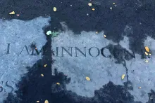 Gray stone etched with the words, I am innocent.